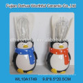 Creative ceramic utensil holder with penguin design